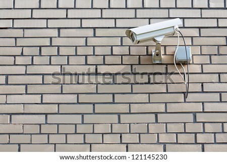 CCTV Security Camera. Security camera mounted on the outdoors brick wall.