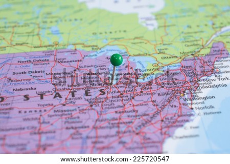 A map pin with a green head, placed at Chicago, IL on a map.