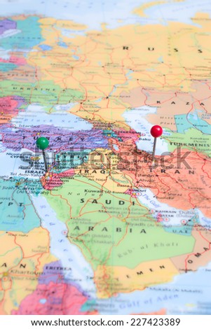 Map pins placed at Israel and Tehran, Iran. A green map pin placed at Israel and a red map pin placed at Tehran.