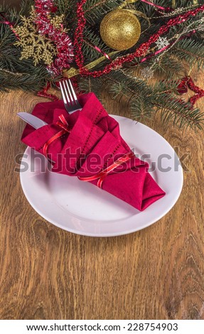 Christmas dinner invitation on wooden background