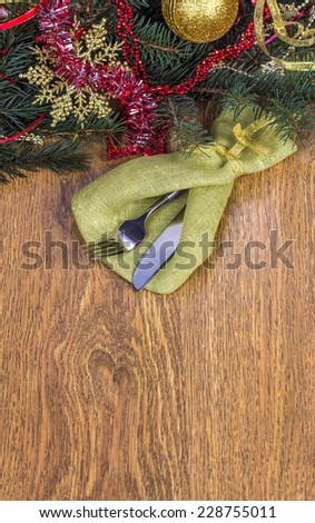 Christmas dinner invitation on light brown wooden background
