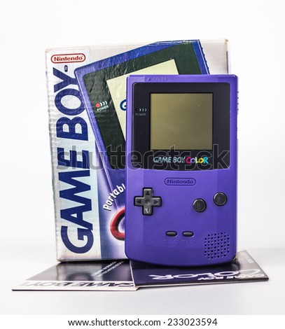 SAINT-PETERSBURG, RUSSIA - November 24, 2014: A studio shot of a Nintendo Game Boy Color with box and instruction. A popular handheld video game device which has sold over 100 million units worldwide.