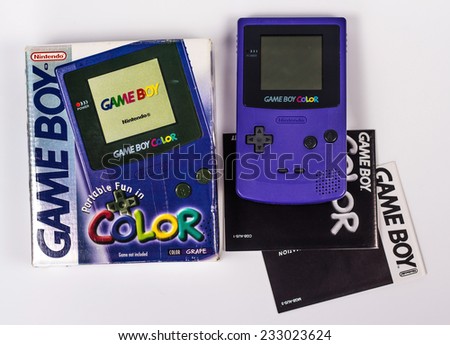 SAINT-PETERSBURG, RUSSIA - November 24, 2014: A studio shot of a Nintendo Game Boy Color with box and instruction. A popular handheld video game device which has sold over 100 million units worldwide.