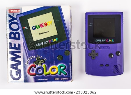 SAINT-PETERSBURG, RUSSIA - November 24, 2014: A studio shot of a Nintendo Game Boy Color with box. A popular handheld video game device.