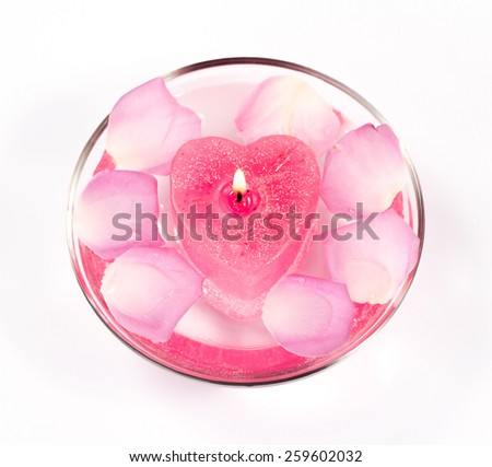 Infused water with rose petals in a reflection bowl