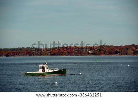 PORTLAND, MAINE - NOVEMBER 3, 2015 - Local lobster boat is anchored in Casco Bay in  Portland, Maine after a day of hauling lobster traps in the Atlantic Ocean.