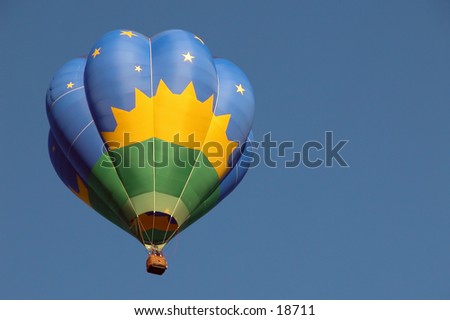 Blue On Blue:  Hot air balloon, from First Annual Hugo Oklahoma Balloon Festival, taking flight