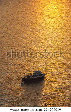 fishing boat going out for a sunset