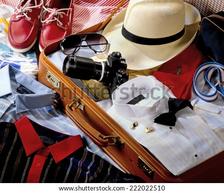 SUITCASE PACKED WITH CLOTHES
