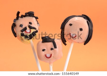 Faces party lollipop cakes.