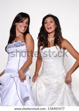 Happy brides dancing and celebrating together.Dancing women.