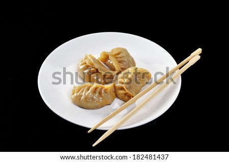 Chinese food ravioli on dish.Chinese vegetarian dumplings