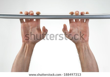 Hands hanging a metallic bar.perseverance concept.