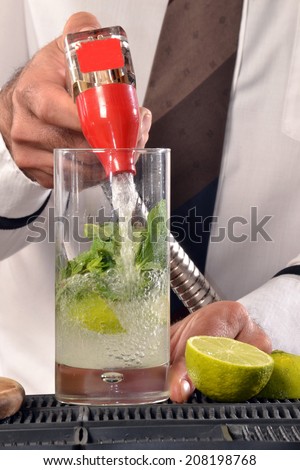 Barman preparing cocktail.Bartender preparing cocktail.