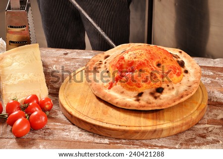 Preparing calzone pizza bread.