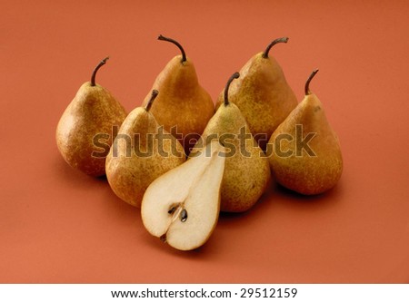 Group uf pears on orange background.Cut pear.Half pear.