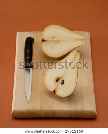 Cut pear on a wood table.Half pear.