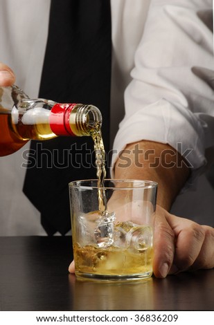 Pouring drink. Bartender pouring liquor, Barman pouring a drink.
