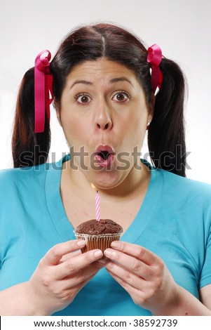 Fat girl holding a chocolate snack cake,happy girl holding a chocolate snack cake,woman eating  chocolate snack cake.