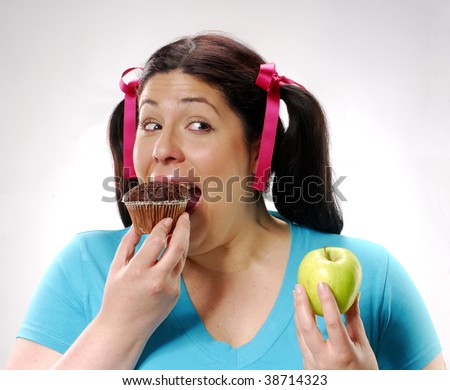 picture of fat kid eating cake. stock photo : One young fat