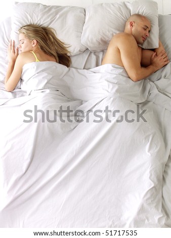Latin american couple on bed.