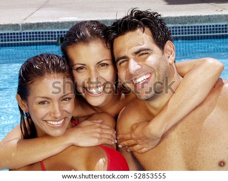 Portrait of a latin couple in a swimming pool,