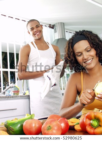 Afro american couple in a kitchen.   Latin couple cooking.