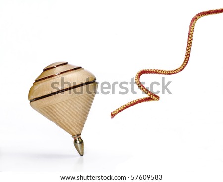 Wood spinning top on white background and string.
