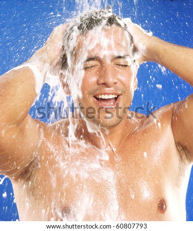 stock photo Young latin man taking a shower