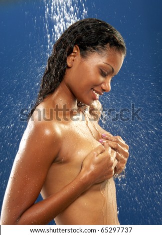 Young latin woman taking a shower. Young latin woman washing her hair. Young afro american woman taking a shower.