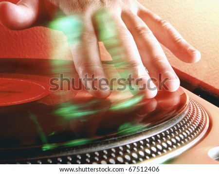 Working Disc jockey at party. Detail of a dj hands.Deejay spinning.