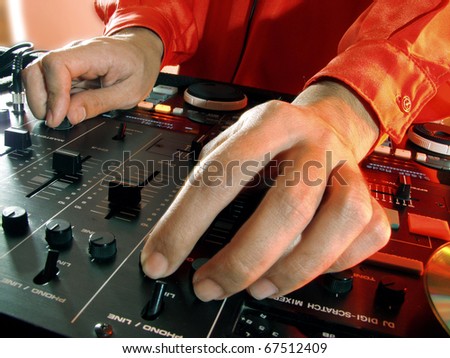 Working Disc jockey at party. Detail of a dj hands.