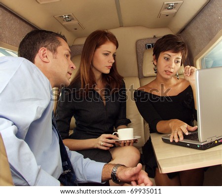 Business people working at private jet.