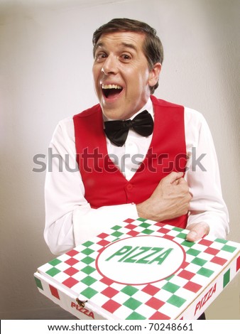 Pizza delivery man holding pizza box . Waiter holding a pizza box.