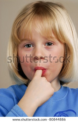 stock photo Little girl sucking her finger