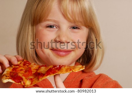 Little girl eating pizza,kid eating pizza.