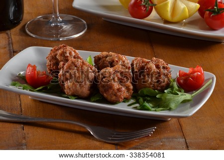 Fried meat balls filled with cheese dish.