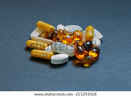Various pills of vitamins and minerals.