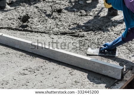 plasterer concrete cement work. leveling concrete slab floor work step of the building construction