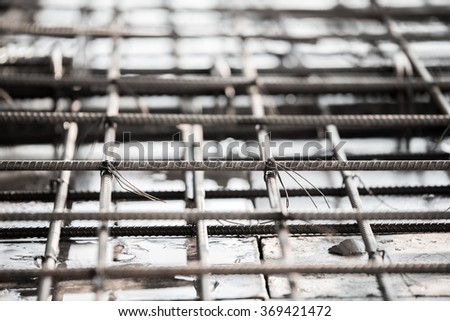 Using steel wire for securing steel bars with wire rod for reinforcement of concrete slab or focus to steel wire.