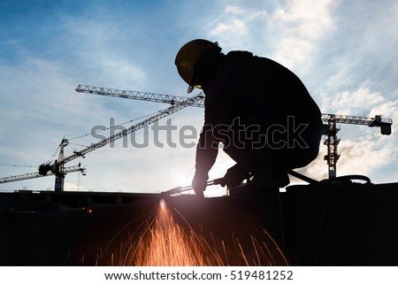 Silhouettes of alienate worker to cutting steel in construction site with Oxy-Propane cutting