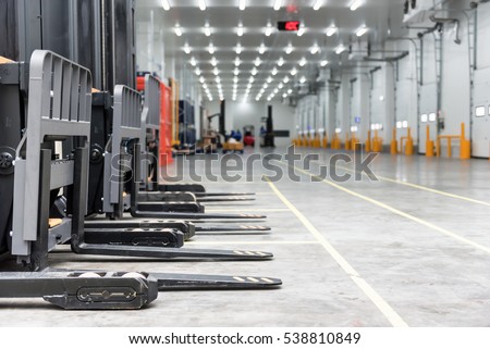 Loading area in the warehouse cold room  with forklift standing