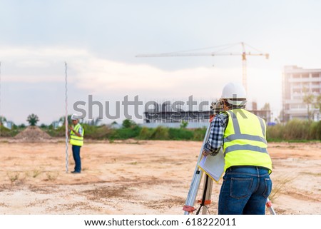 Surveyor equipment. Surveyor’s telescope at construction site or Surveying for making contour plans are a graphical representation of the lay of the land before startup construction work
