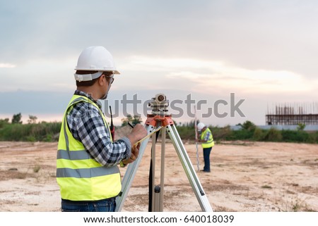 Surveyor equipment. Surveyor’s telescope at construction site, Surveying for making contour plans are a graphical representation of the lay of the land before startup construction work