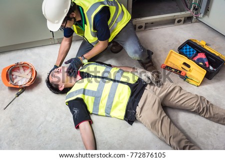 Tilt Head, Life-saving and rescue methods. Accident at work of electrician job or Maintenance worker in the control room of factory.