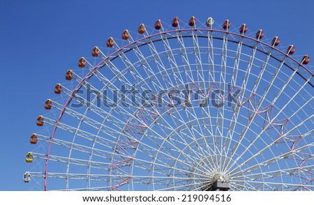 The highest Tempozan Gaint Ferris Wheel (Daikanransha) in the clear sky at Osaka,Japan; This farris wheel have many colorful 60 gondolas and some can see-through for exciting experience.