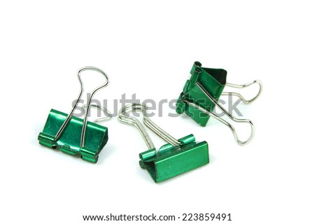 Old Green Paper clip isolated on white background.; The paper binder clip used for paper and documents. It can use for  background and other up to your decoration.