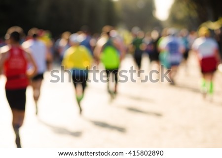 blurry picture of runners in a marathon