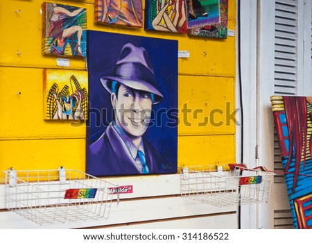 BUENOS AIRES, ARGENTINA - AUGUST 27: Carlos Gardel Tango paintings exhibited at Caminito street in the famous La Boca neighborhood, 2015 in Buenos Aires, Argentina.