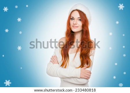 Casual dressed sexy redhead woman in white hat with beautiful smile on decorated blue background